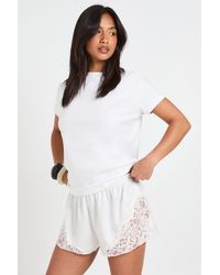 Boohoo - Petite Satin Lace Trim Runner Short - Lyst