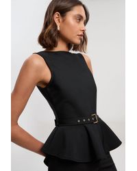 Karen Millen - Figure Form Bandage Peplum Belted Knit Top - Lyst