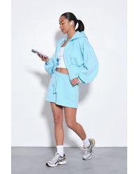 Boohoo - Cinched Waist Zip Through Cropped Hooded Short Tracksuit - Lyst