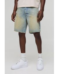 BoohooMAN - Relaxed Fit Extreme Washed Raw Hem Jean Shorts - Lyst