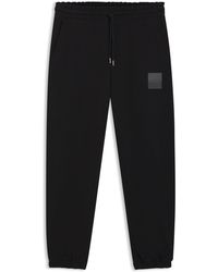 HUGO - Cotton-Terry Tracksuit Bottoms With Split Logo - Lyst