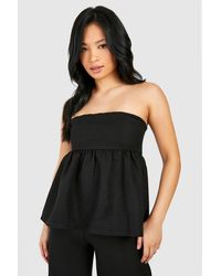 Boohoo - Petite Textured Bandeau Peplum Top - Lyst