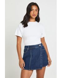 Boohoo - Petite Wrap Front Denim Skort - Lyst