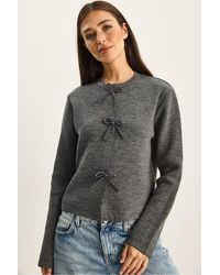 Bianco Lucci - Crew Neck Knit Cardigan With Bow Detail - Lyst
