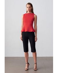 Dilvin - Aansluitende Mouwloze Peplum Blouse - Lyst