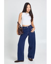 Boohoo - Petite Mid Waist Twisted Seam Barrel Leg Jean - Lyst