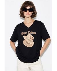 Bianco Lucci - Oversized V-Neck Printed T-Shirt - Lyst