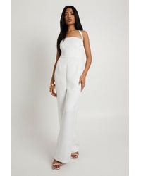 Boohoo - Premium Satin Boned Corset Halterneck Wide Leg Jumpsuit - Lyst