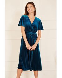Yumi' - Teal Wrap Over Midi Dress With Angel Sleeves And Split Hem - Lyst