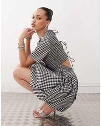 Amy Lynn - Shirred Peplum Mini Dress With Tie Back - Lyst