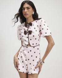 River Island - Playsuit Polka Dot Bow Front Round Neck - Lyst