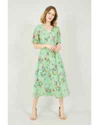 Yumi' - Saliegroene Midi-jurk Met Bloesem-en Vlinderprint - Lyst