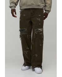 BoohooMAN - Overdye Camo Rip & Repair Baggy Fit Jeans - Lyst