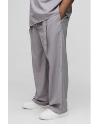 BoohooMAN - Plus Relaxed Fit Tailored Belted Pleat Pants - Lyst