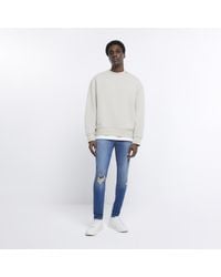 River Island - Jeans Super Skinny Ripped Spray On Cotton - Lyst