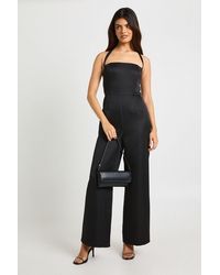 Boohoo - Premium Satin Boned Corset Halterneck Wide Leg Jumpsuit - Lyst