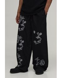 BoohooMAN - Baggy Fit Linen Blend Small Floral Embroidery Trousers - Lyst