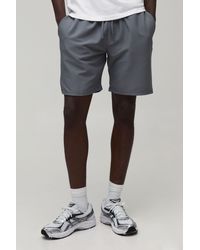 BoohooMAN - Essential Relaxed Fit Elasticated Tech Shorts - Lyst