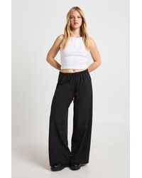 Boohoo - Petite Woven Elasticated Waist Drawstring Wide Leg Trouser - Lyst
