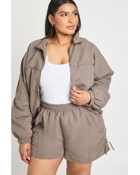 Boohoo - Plus Funnel Zip Up Nylon Track Jacket Short Set - Lyst