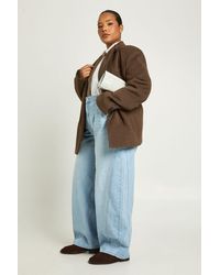 Boohoo - Plus Mid Waist Twisted Seam Barrel Leg Jean - Lyst