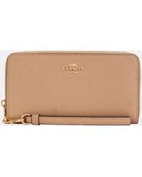 COACH - Accordion Zip Around Purse - Lyst