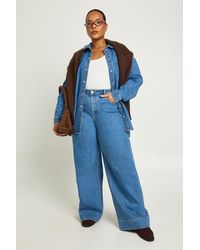 Boohoo - Plus Mid Waist Deep Hem Wide Leg Jean - Lyst
