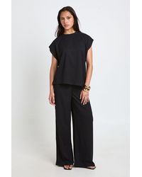 Boohoo - Crinkle Asym Hem Top Straight Leg Co Ord - Lyst