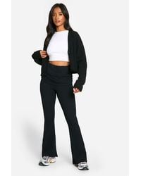 Boohoo - Petite Fold Over Waistband Crinkle Flare Trouser - Lyst