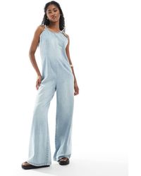 Monki - Lightweight Denim Halter Neck Jumpsuit - Lyst