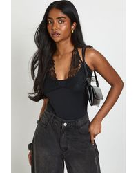 Boohoo - Matte Slinky Lace Trim Halter Neck Bodysuit - Lyst