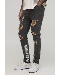 BoohooMAN - Tall Stacked Skinny Distressed Embroidered Gusset Jeans - Lyst