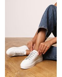 Where's That From - 'Florina' Low Wedge Trainer With Lace Up Detail Faux Leather - Lyst
