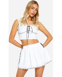 Boohoo - Broderie Contrast Bow Mini Skirt - Lyst