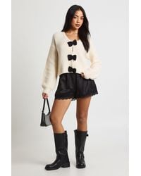 Boohoo - Chunky Knit Oversized Bow Button Cardigan - Lyst