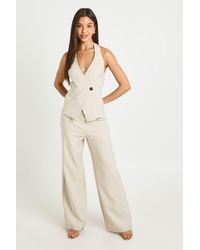 Boohoo - Crepe Button Wrap Front Jumpsuit - Lyst