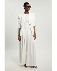 Karen Millen - Petite Tailored Structured Crepe Pleated Wide Leg Trousers - Lyst