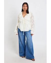 Boohoo - Plus Burnout Ruffle Tie Front Smock Top - Lyst