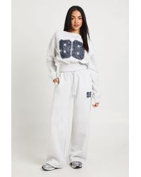 Boohoo - 98 Print Off Shoulder Straight Leg Tracksuit - Lyst
