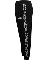 PUMA - Amplified Pants Track Taped Logo Joggers 582843 01 - Lyst