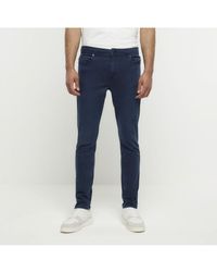 River Island - Skinny Jeans Dark Blue Cotton - Lyst