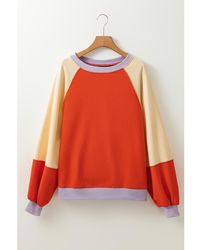 Azura Exchange - Oranje Kleurblok Zijsplitten Raglan Mouw Loose Fit Top - Lyst