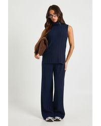 Boohoo - Petite Soft Knit Longline Roll Neck Sleeveless Sweater And Wide Leg Trouser Co-Ord - Lyst