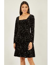 Mela London - Star Foil Print Long Sleeve Skater Dress - Lyst