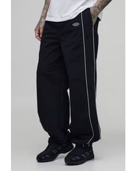 BoohooMAN - Tall Relaxed Fit Elasticated Front Binding Toggle Hem Track Pants - Lyst