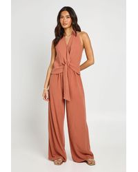 Boohoo - Halterneck Linen Look Knot Front Wide Leg Jumpsuit - Lyst