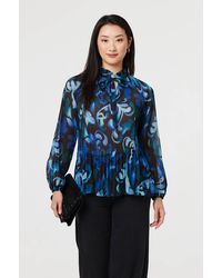 Izabel London - Printed Pleated Long Sleeve Tunic Blouse - Lyst