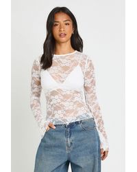 Boohoo - Petite Lace Boat Neck Flare Sleeve Top - Lyst