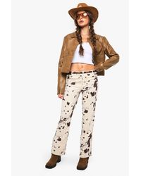 Boohoo - Faux Suede Cow Print Flare Pants - Lyst