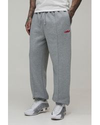 BoohooMAN - Tall Regular Fit Exposed Seam Embroidered Cuffed Jogger - Lyst